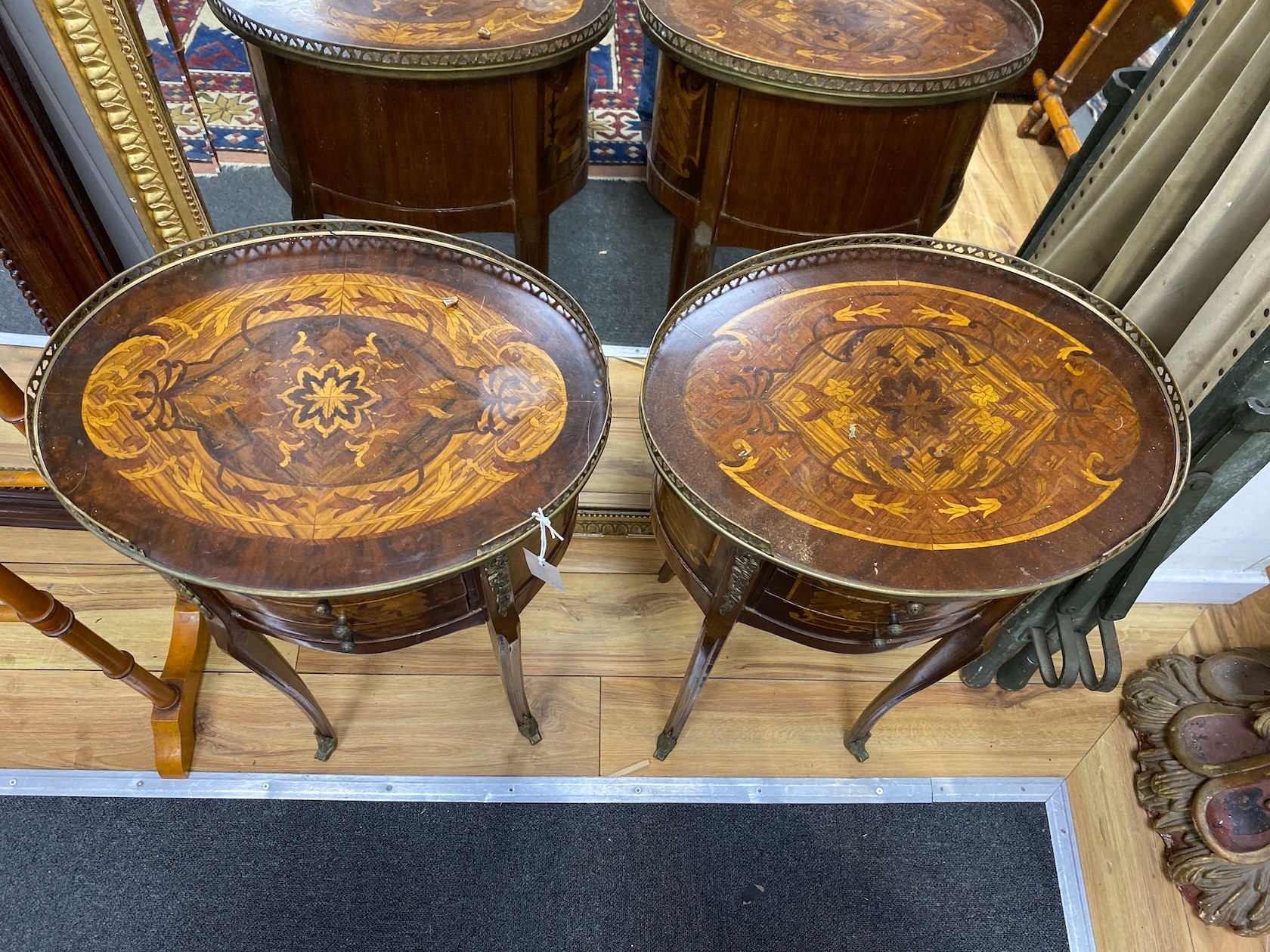 A pair Louis XVI style marquetry inlaid, gilt metal mounted three drawer bedside chests, width 44cm, depth 33cm, height 74cm.